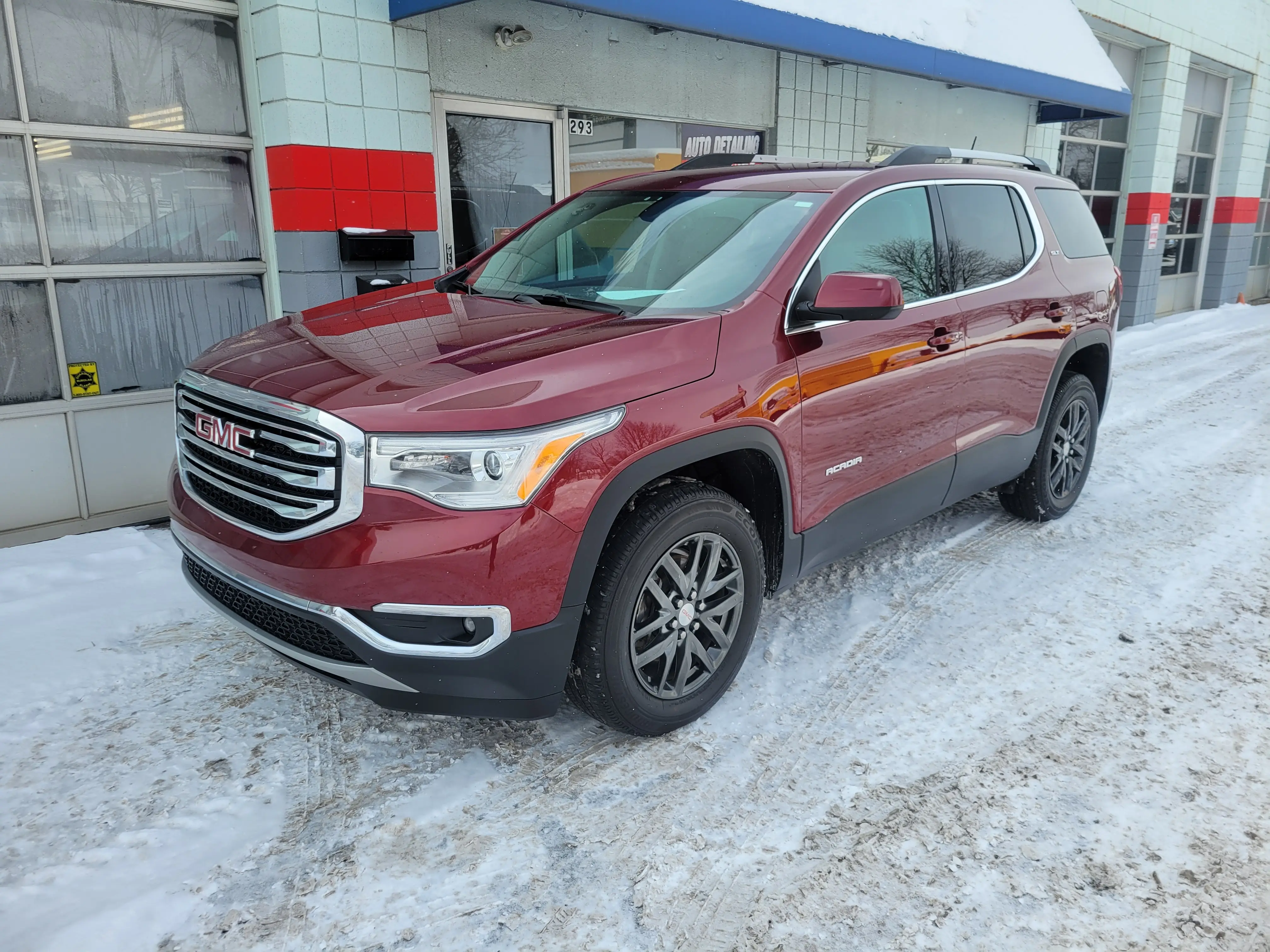 A reconditioned GMC Acadia finished outside the Fast Track Detailing Solutions shop in Oakland County, Michigan