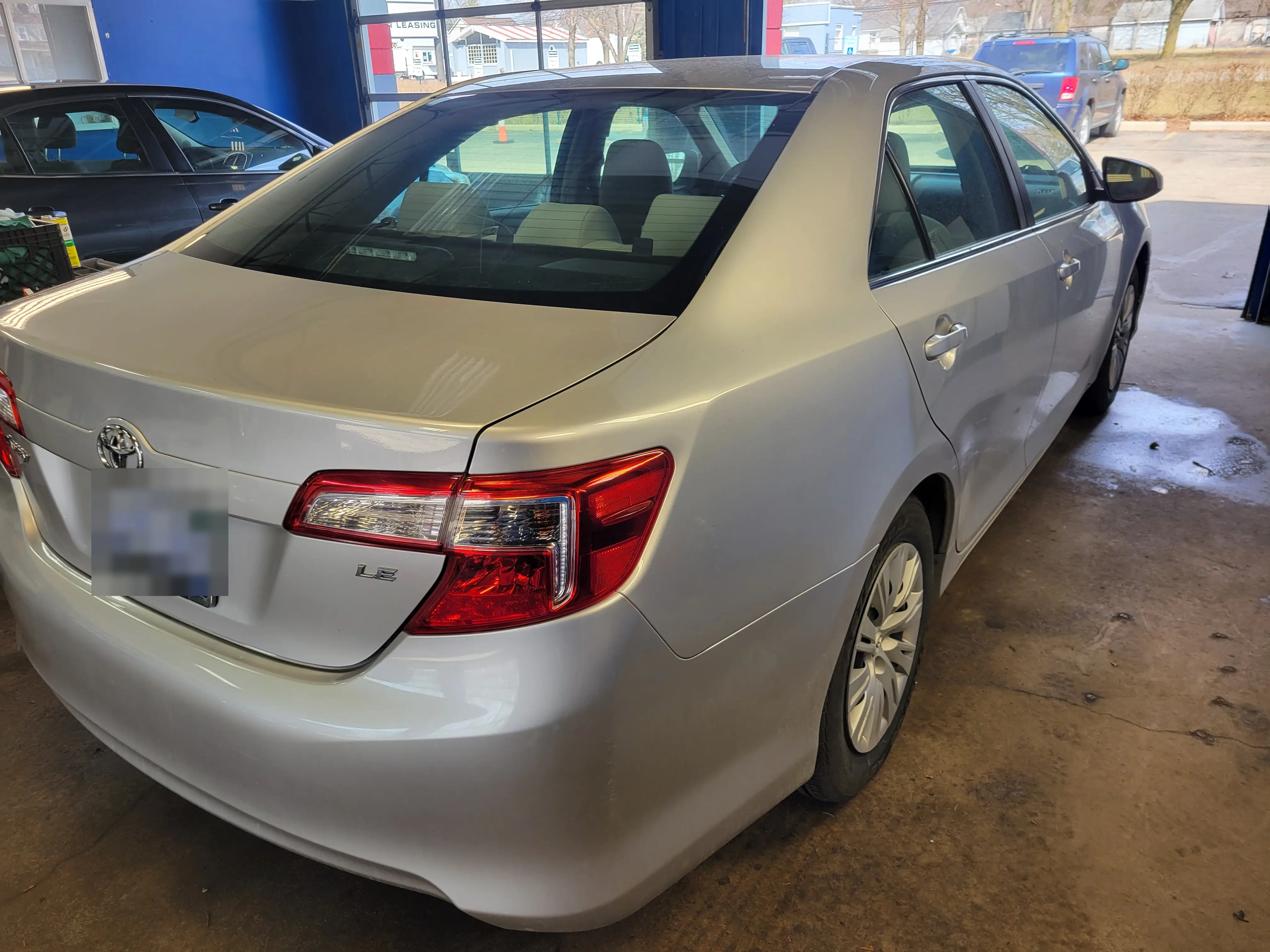 The same Toyota Camry after detailing, fully cleaned and polished