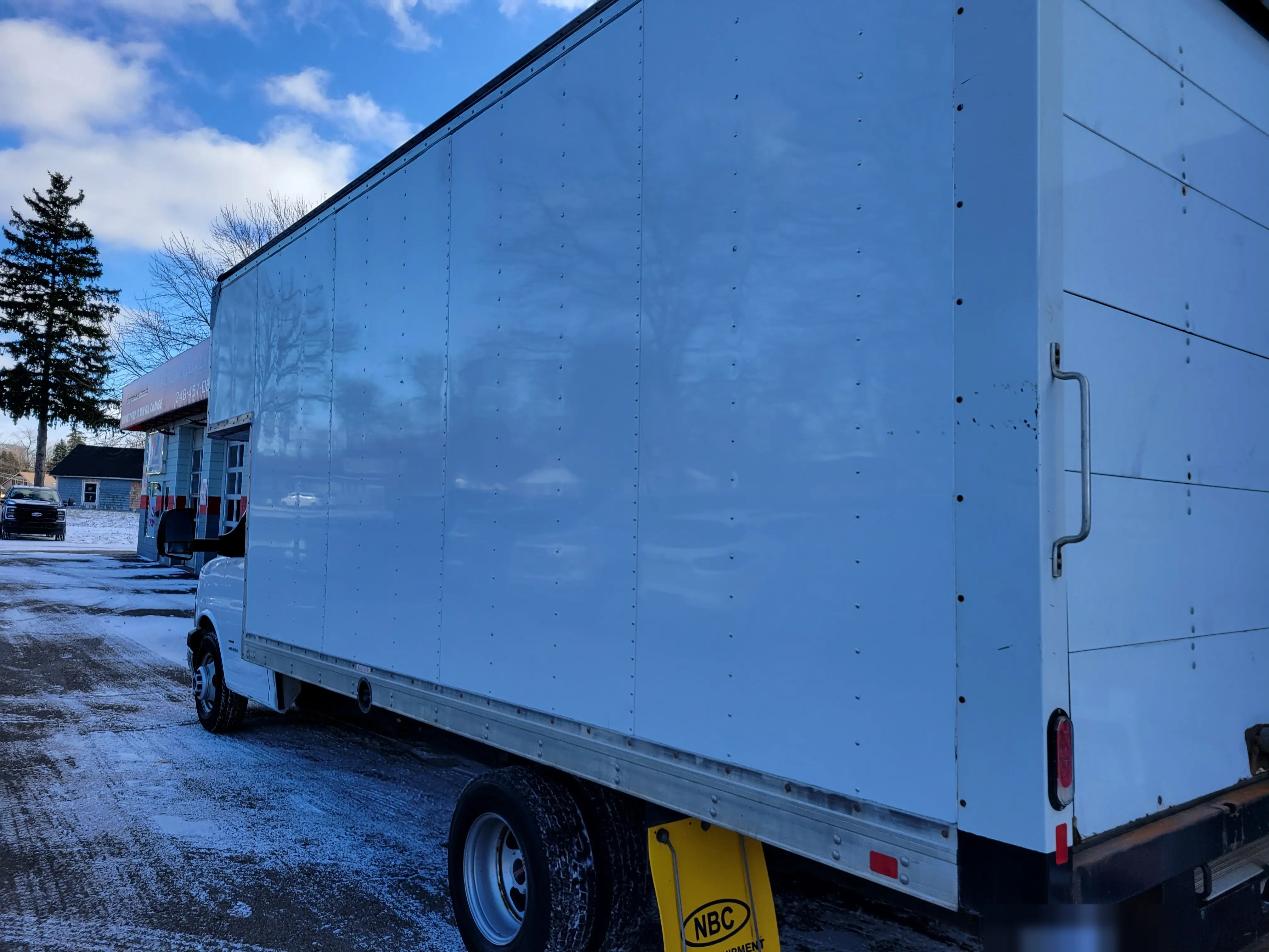 The same box truck after the wrap and decals were removed, panels clean and free of adhesive